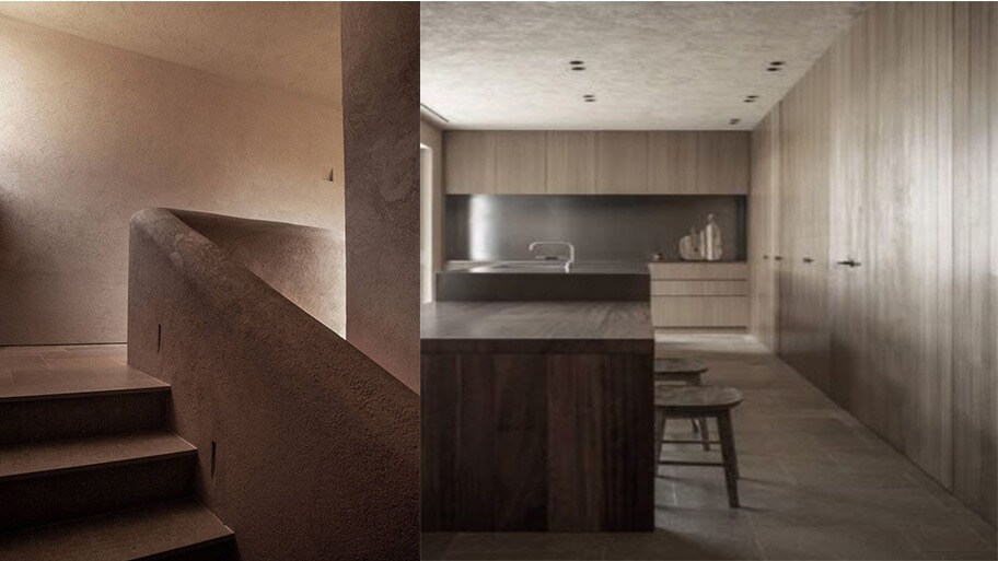 Cầu thang xoắn gỗ và phòng bếp hiện đại với nội thất màu nâu sẫm và ánh sáng tự nhiên.