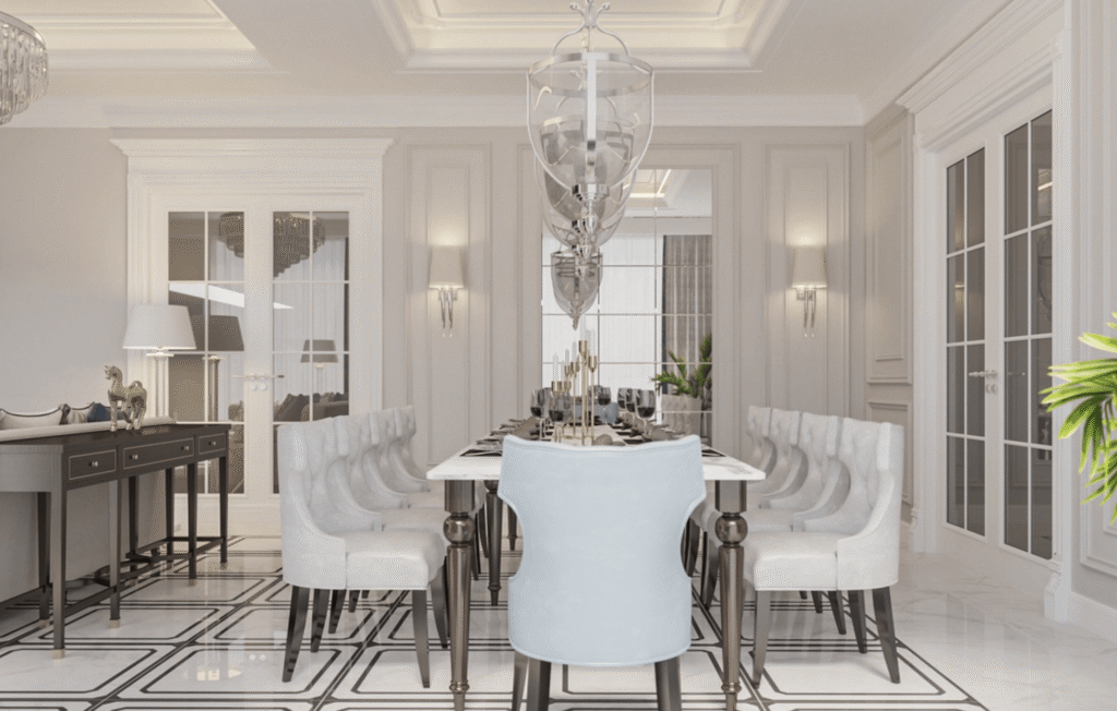 Phòng ăn sang trọng với bàn dài, ghế bọc da trắng và đèn chùm hiện đại.