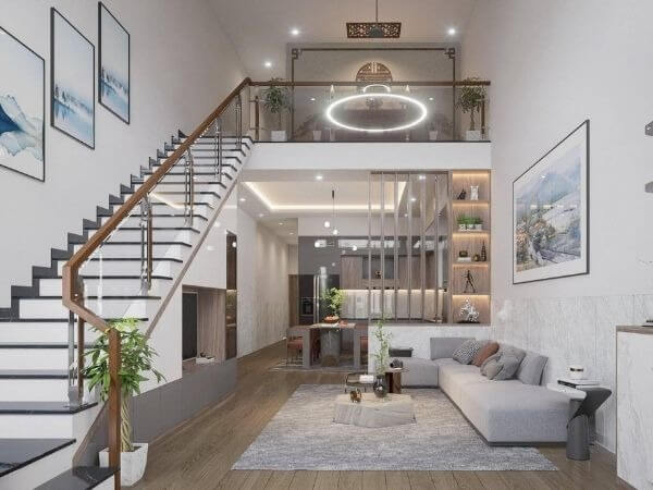 Phòng khách hiện đại với ghế sofa màu xám, cầu thang gỗ và đèn trần tròn sáng tạo.