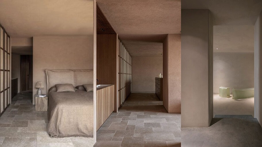 Phòng ngủ tối giản với giường nệm màu be, tường gỗ sáng và ánh sáng dịu nhẹ.