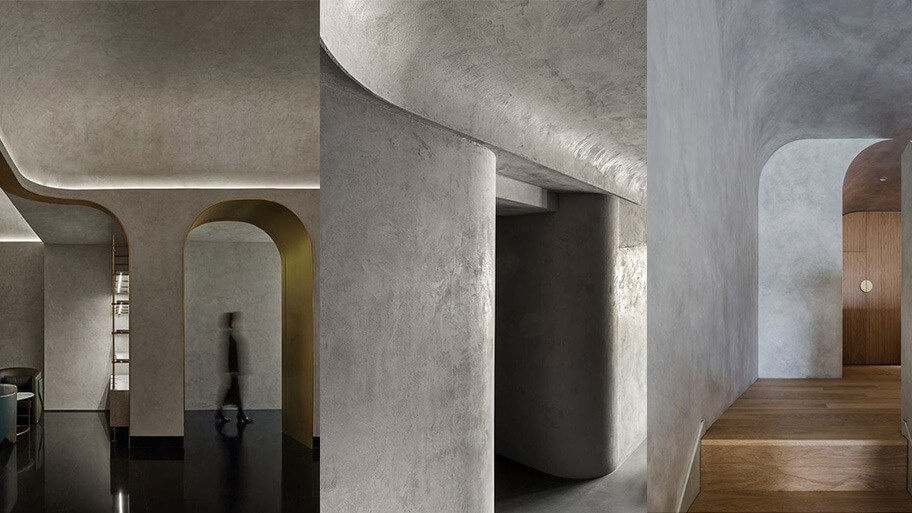 Nội thất hiện đại với tường bê tông cong và ánh sáng tinh tế trong thiết kế kiến trúc cao cấp.