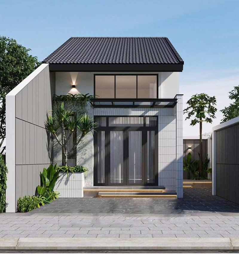 Nhà mái ngói hiện đại với cửa kính lớn, cây xanh bên cạnh, tường màu xám nhạt tạo không gian thoáng đãng.