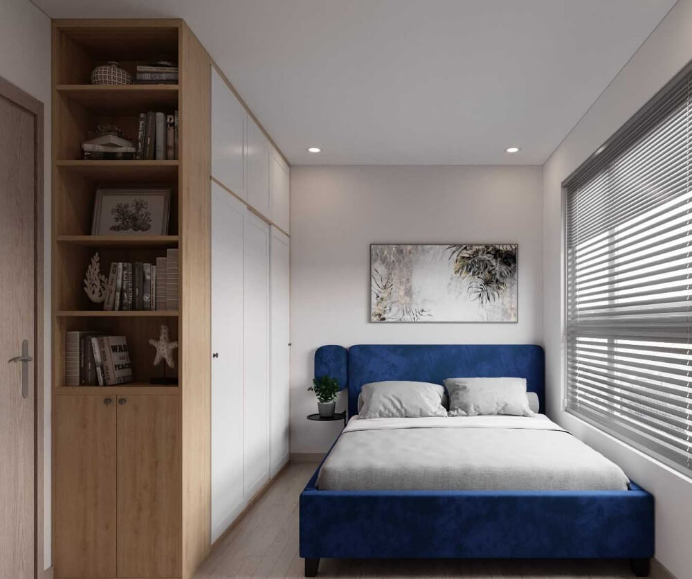 Phòng ngủ hiện đại với giường màu xanh dương, tủ gỗ và cửa sổ lớn có rèm, ánh sáng tự nhiên.