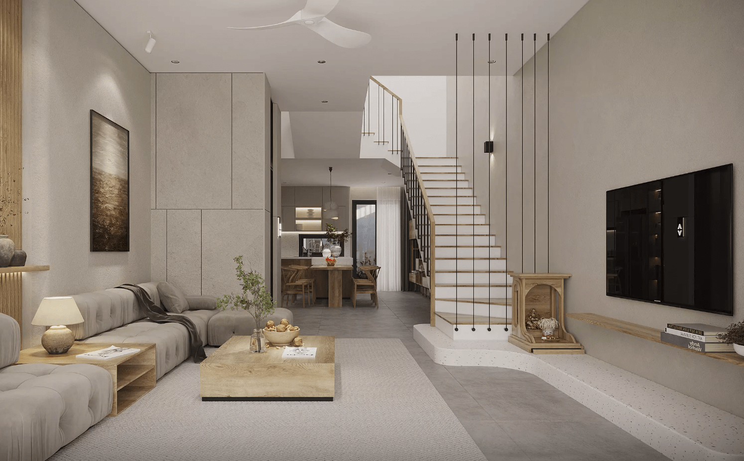 Phòng khách hiện đại với sofa màu xám, bàn gỗ, và cầu thang dẫn lên tầng hai.